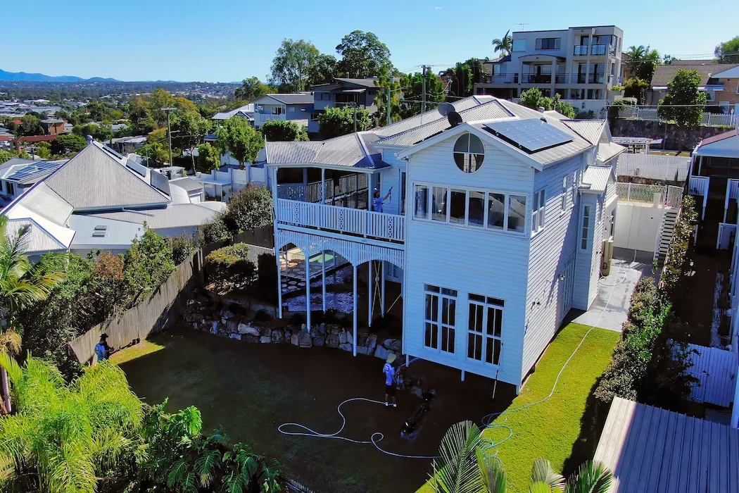 kg-house-washing-4 Aerial view of Australian style house with multiple Kleen Genie technicians cleaning multiple parts of the property